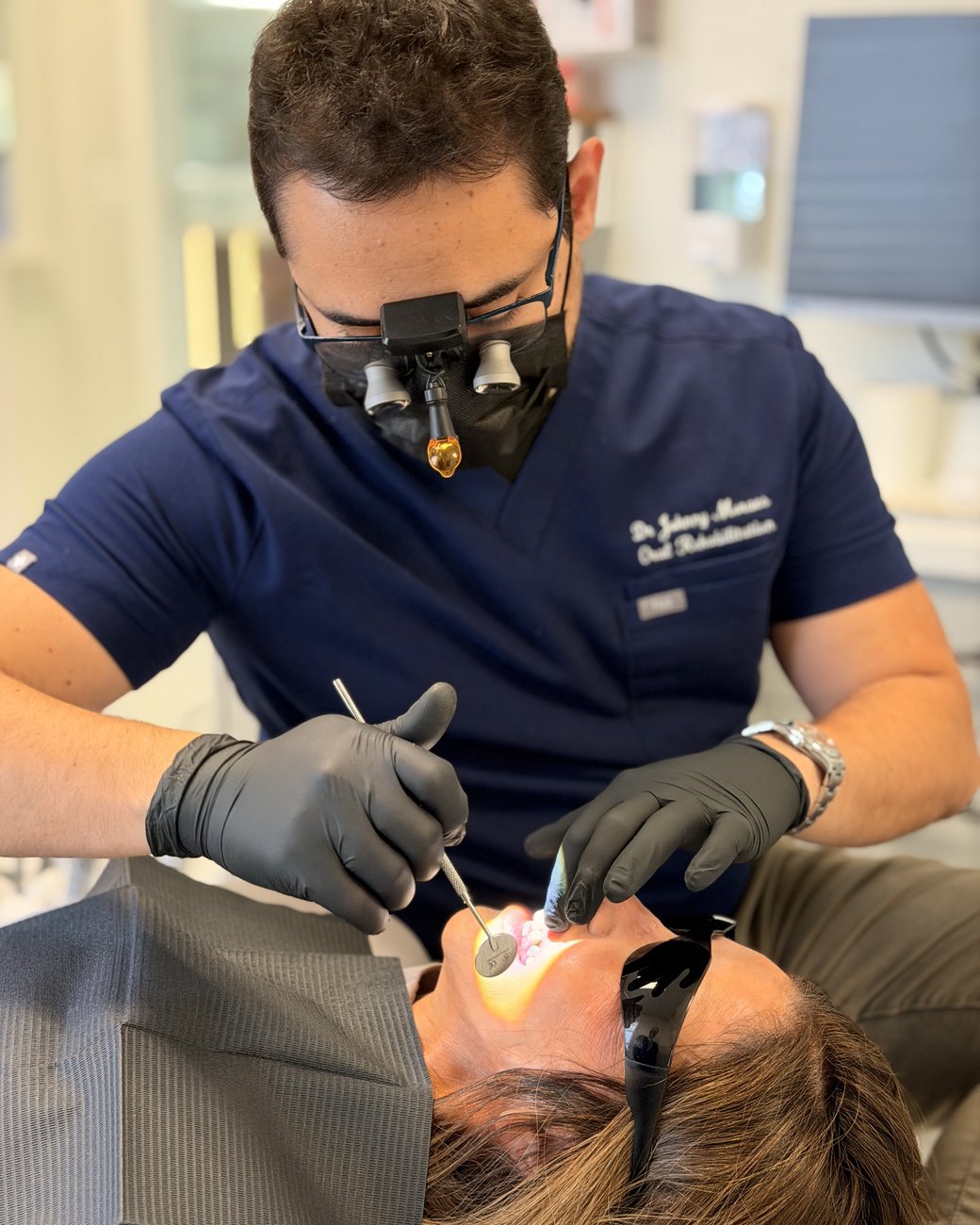 Dr. Johnny Moraes during a dental procedure