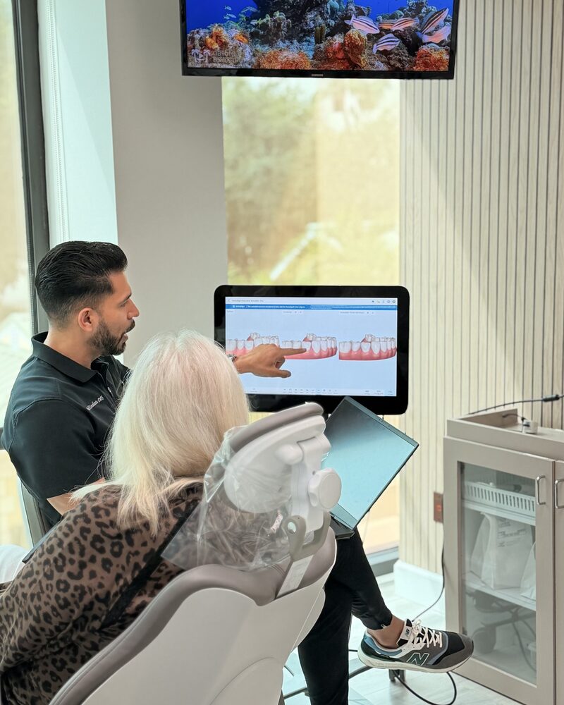 Dr. David Escalante reviewing a digital scan with a patient