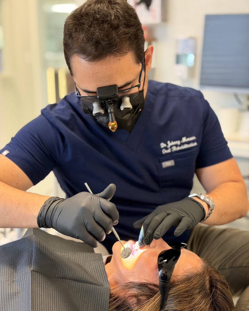 Dr. Johnny Moraes working with magnification loupes